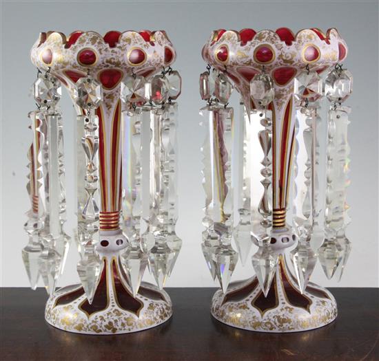 A pair of Bohemian ruby and white overlaid glass table lustres, late 19th century, 26cm